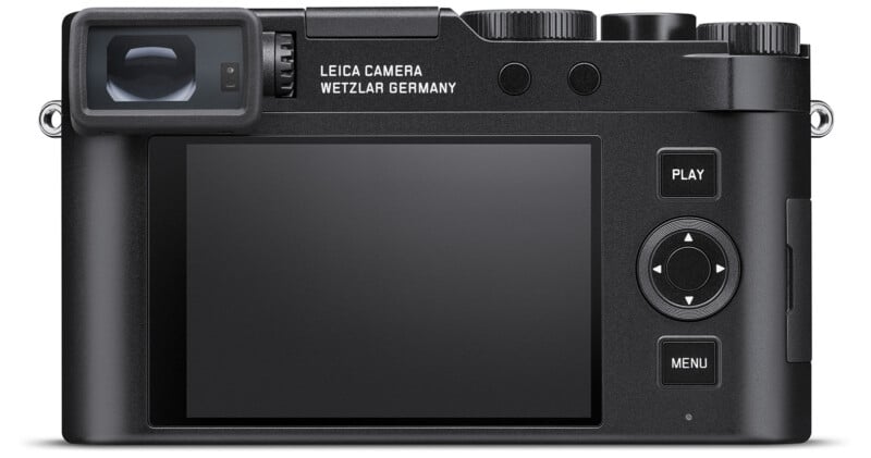 The back view of a black Leica camera with a large LCD screen, including several buttons "Play" And "Menu," and a viewfinder.  Text on camera says "Leica Camera Wetzlar Germany." The camera is against a white background.