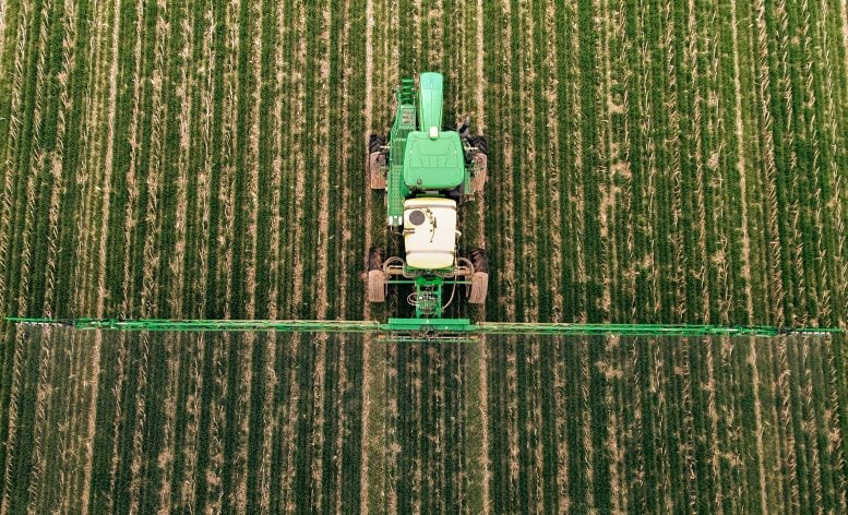 Machine sprays cover crops in a field in Western Kentucky