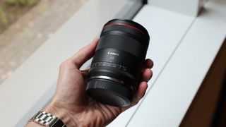 Canon RF 35mm f/1.4L VCM lens in hand