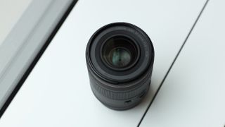 Canon RF 35mm f/1.4L VCM lens on a white surface in front of a window