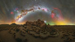 Milky Way arc photographed above a mountain of rocks in the Atacama Desert, Chile