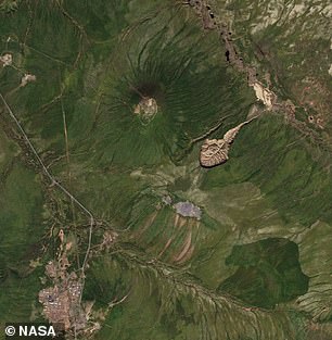 Above, a 2016 NASA satellite image of the Batagaika crater expansion