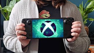 GamesRadar+ hardware editor Phil Hayton holds Steam Deck OLED with Xbox logo on screen