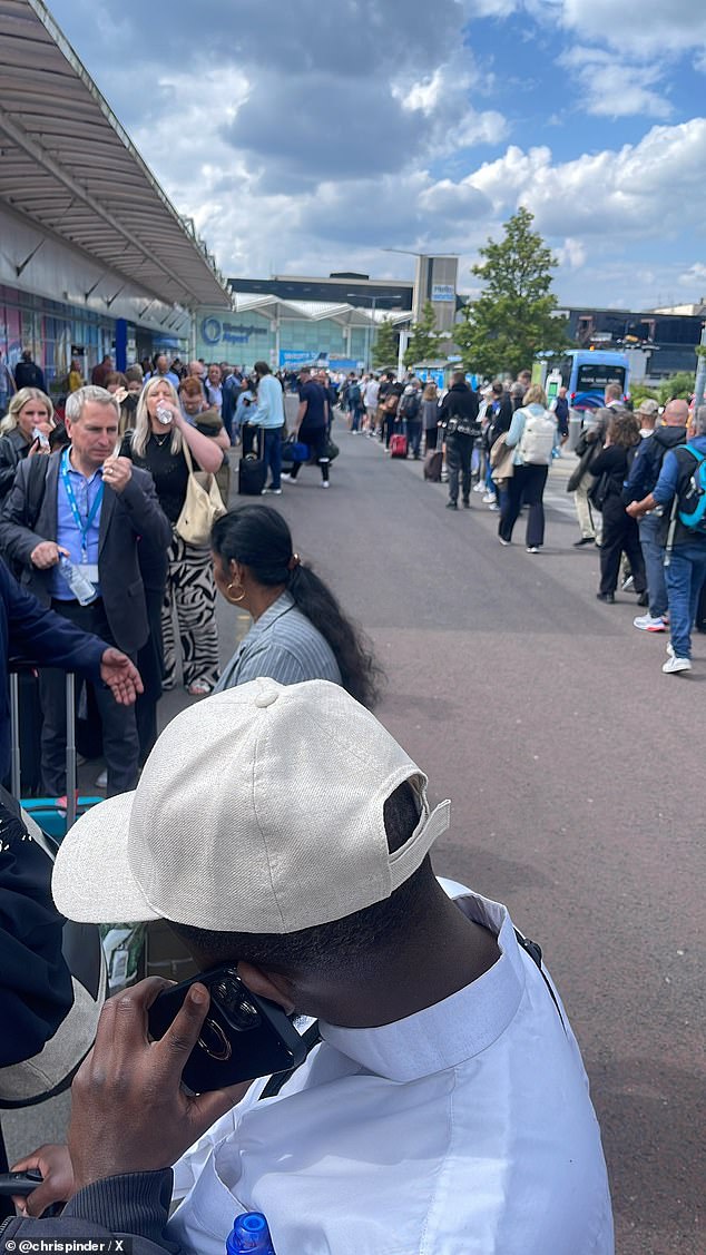 Huge queues have been seen outside the terminal, snaking around the side of the building