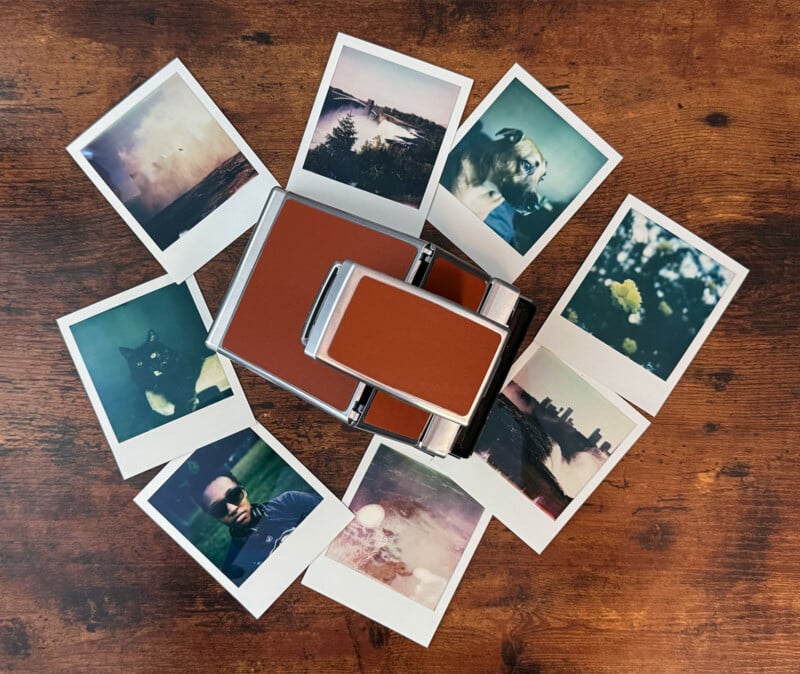 A vintage instant camera lies on a wooden surface, surrounded by nine Polaroid photos.  The images include nature scenes, a cat and a person wearing sunglasses, and showcase a nostalgic and eclectic range of moments captured on film.