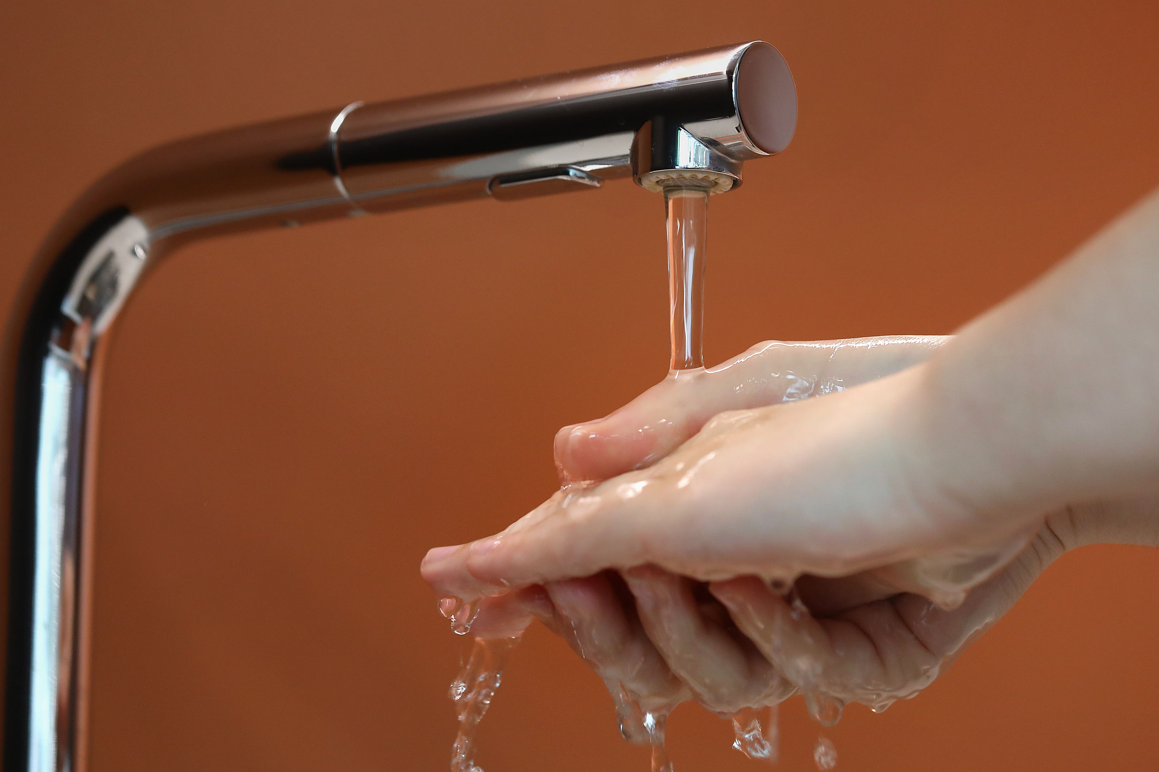 A person washes his hands under the tap (Philip Toscano/PA)