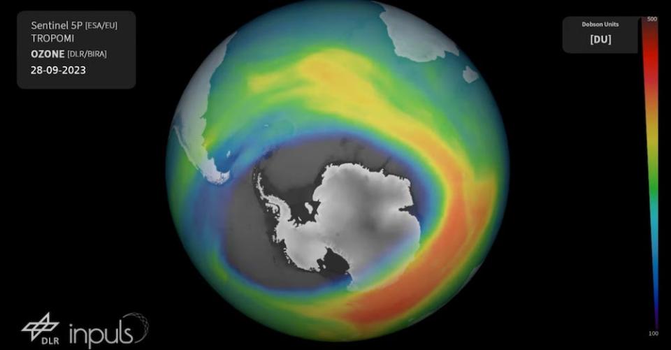 A still from a European Space Agency video showing a multicolored visualization of the ozone layer above the globe, with Antarctica visible through a huge hole, on September 28, 2023.