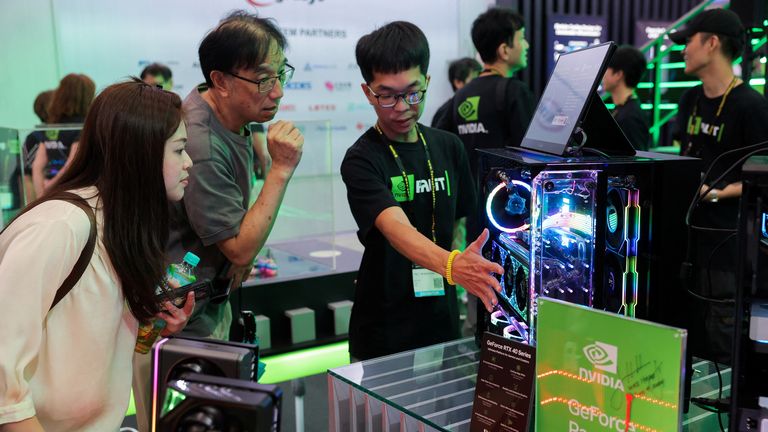 A staff member introduces NVIDIA GeForce series equipment on display at Computex in Taipei, Taiwan, on June 5, 2024.  REUTERS/Ann Wang