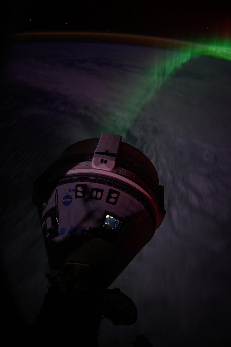 Aurora flows beneath Boeing's Starliner spacecraft