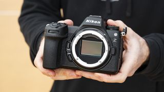 Nikon Z6 III handheld camera with no lens attached and full-frame sensor shown