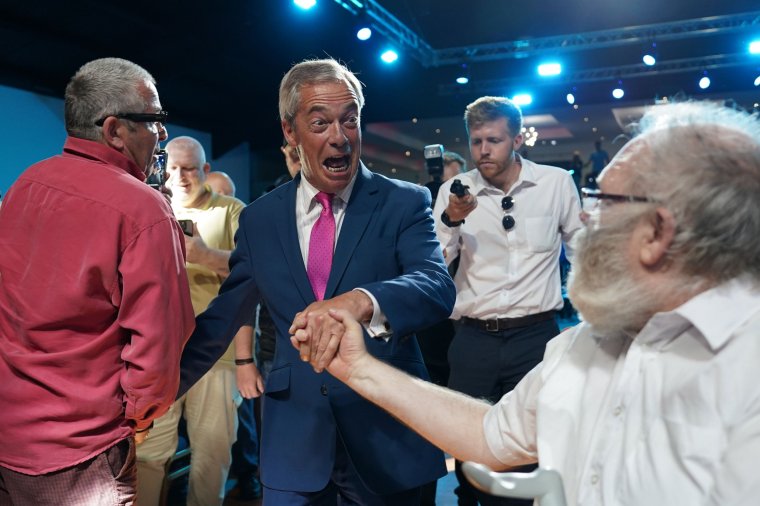 SUNDERLAND, ENGLAND - JUNE 27: British Reform leader Nigel Farage greets supporters during a campaign event at the Rainton Arena in Houghton-le-Spring on June 27, 2024 in Sunderland, United Kingdom. Reform UK is expected to win 14% of the vote on July 4, according to the latest polling data. With a week until polling day, Britain's Reform leader is campaigning in the North East. (Photo by Ian Forsyth/Getty Images) *** BESTPIX ***