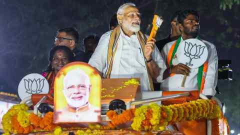 Indian Prime Minister Narendra Modi (center) campaigns with Tamil Nadu Bharatiya Janata Party leader K Annamalai (right) in Chennai on Tuesday