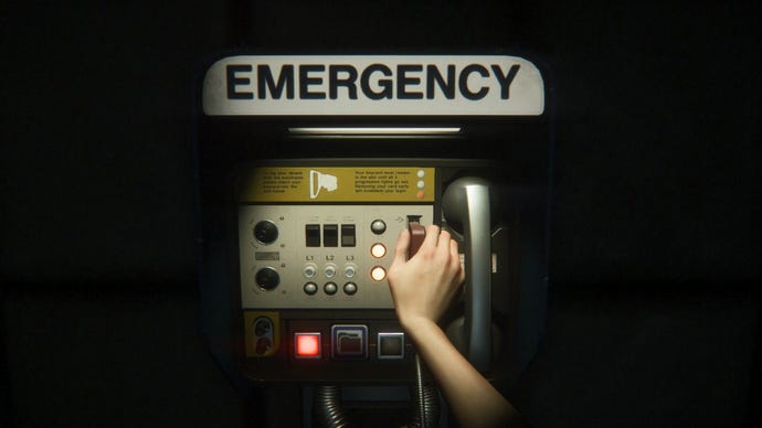 Ripley's inserts a keycard into a machine marked ' "Emergency" to save the game.