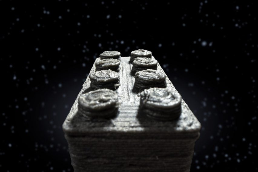 Composite image of a close-up of a 3D printed Lego-like brick appearing to fly through space