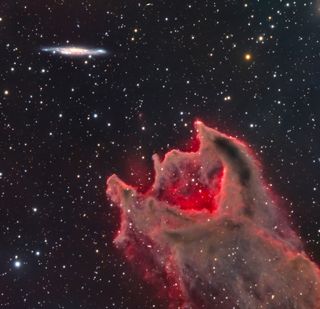 It appears that a worm-shaped gas cloud will devour the stars.