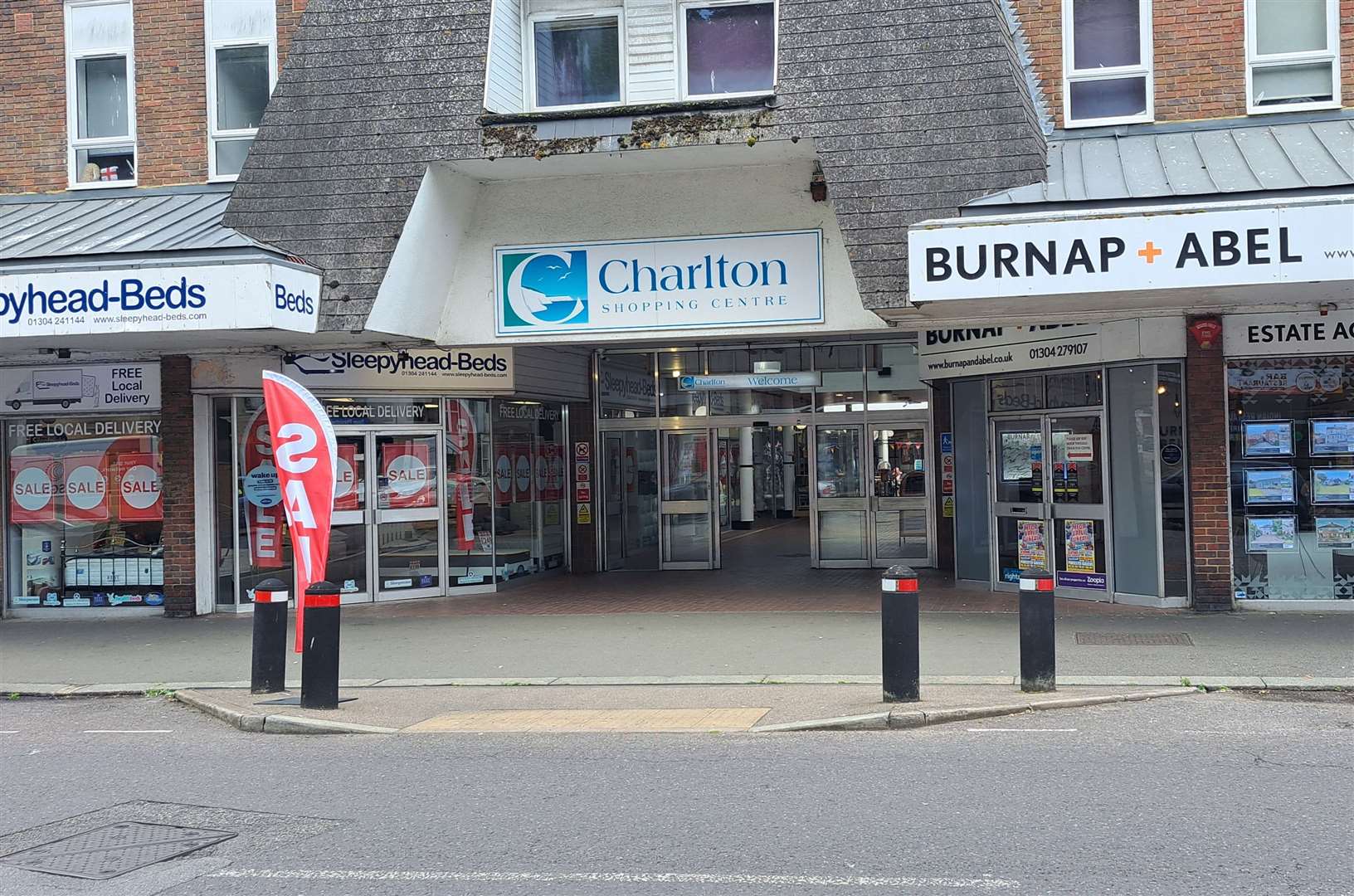 The main entrance to the Charlton Shopping Centre in Dover and two of its businesses