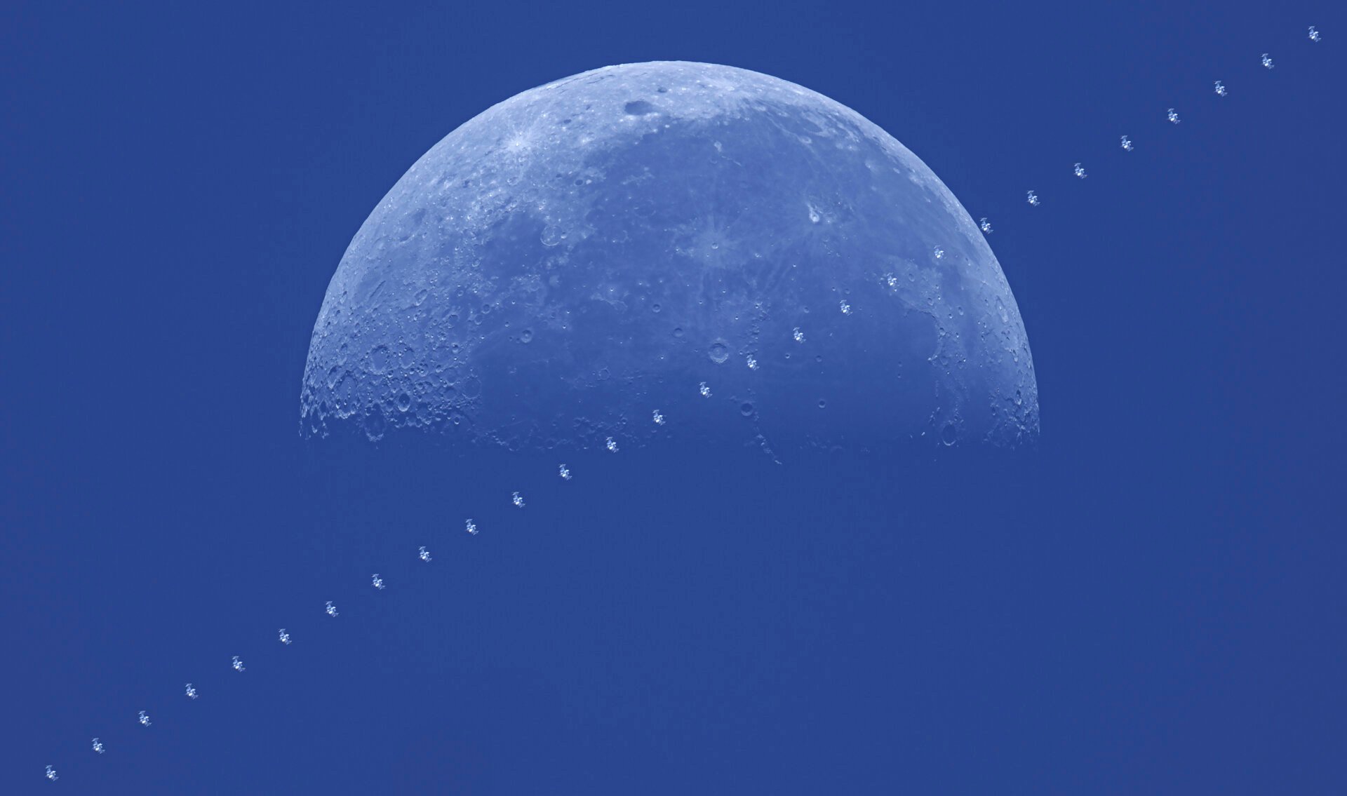 The daytime moon transit from the International Space Station