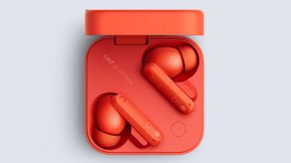 An orange pair of CMF by Nothing Buds Pro 2 wireless earbuds in their box