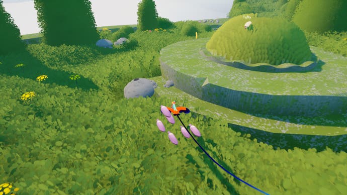 The player approaches a round sheep hill in Flock.