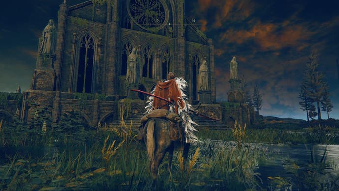 Screenshot from Elden Ring Shadow of the Erdtree showing the player character standing outside an impressive Gothic cathedral