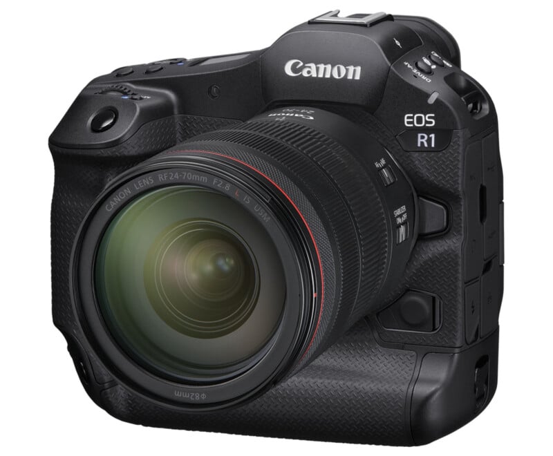 A Canon EOS R1 camera with a large, detachable lens. The black camera has multiple controls, a textured grip for easy handling and a compact, professional design. The lens has detailed specifications visible on the front.