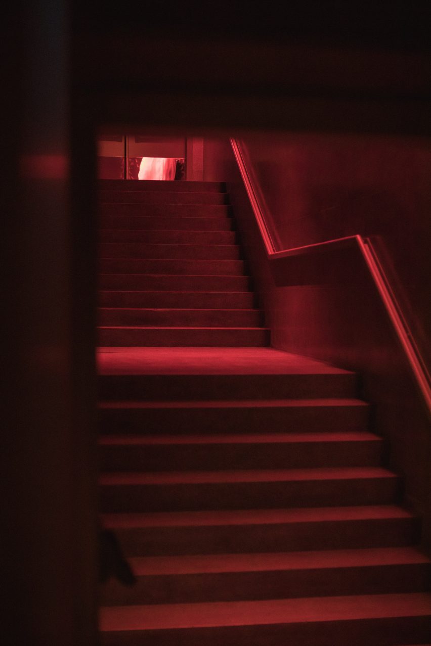 Red-lit stairs lead to the dance floor