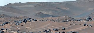 a red-brown landscape of sand and rocks