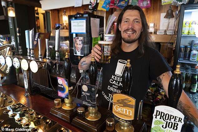 Cheers for that: Landlord Ben Cheshire of The Coronation in Bristol has introduced a two-tiered pricing system to encourage customers to order via their smartphone, and not at the bar