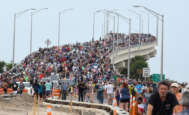 Huge crowds of launch spectators on the A. Max Brewer Bridge in Titusville walk back to their vehicles in May 2020 after a scrub from the historic SpaceX Demo-2 flight, the first U.S. crewed mission in nearly a decade.