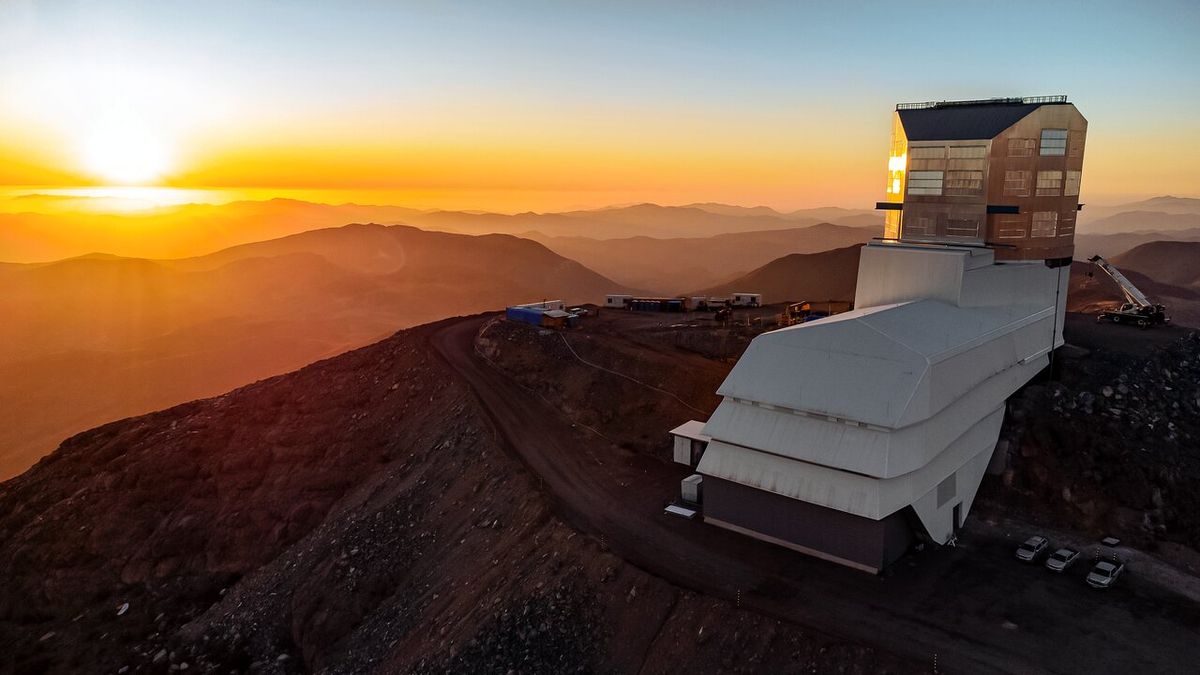 An aerial view of the Vera C. Rubin Observatory in Chile with a spectacular sunset.