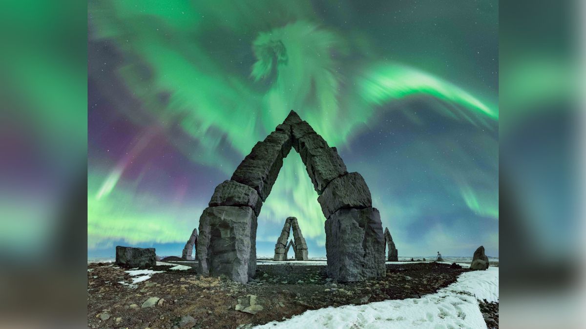 Aurora over arctic henge looks like a dragon.