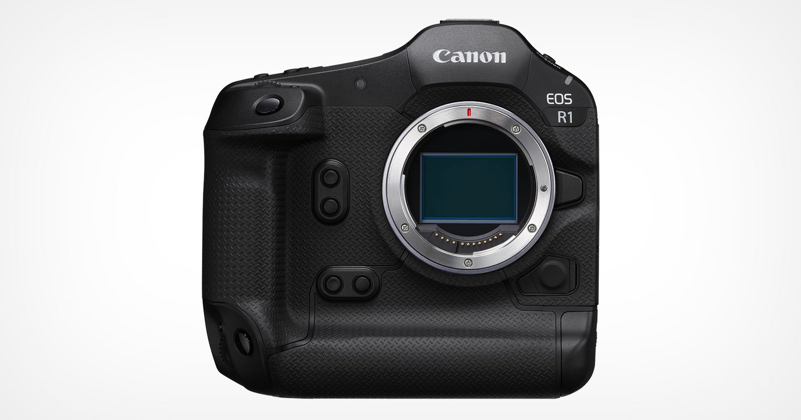 A black Canon EOS R1 digital camera body against a plain white background. The camera has a textured grip, a large lens mount at the center, multiple buttons and dials, and an LCD screen on the back.