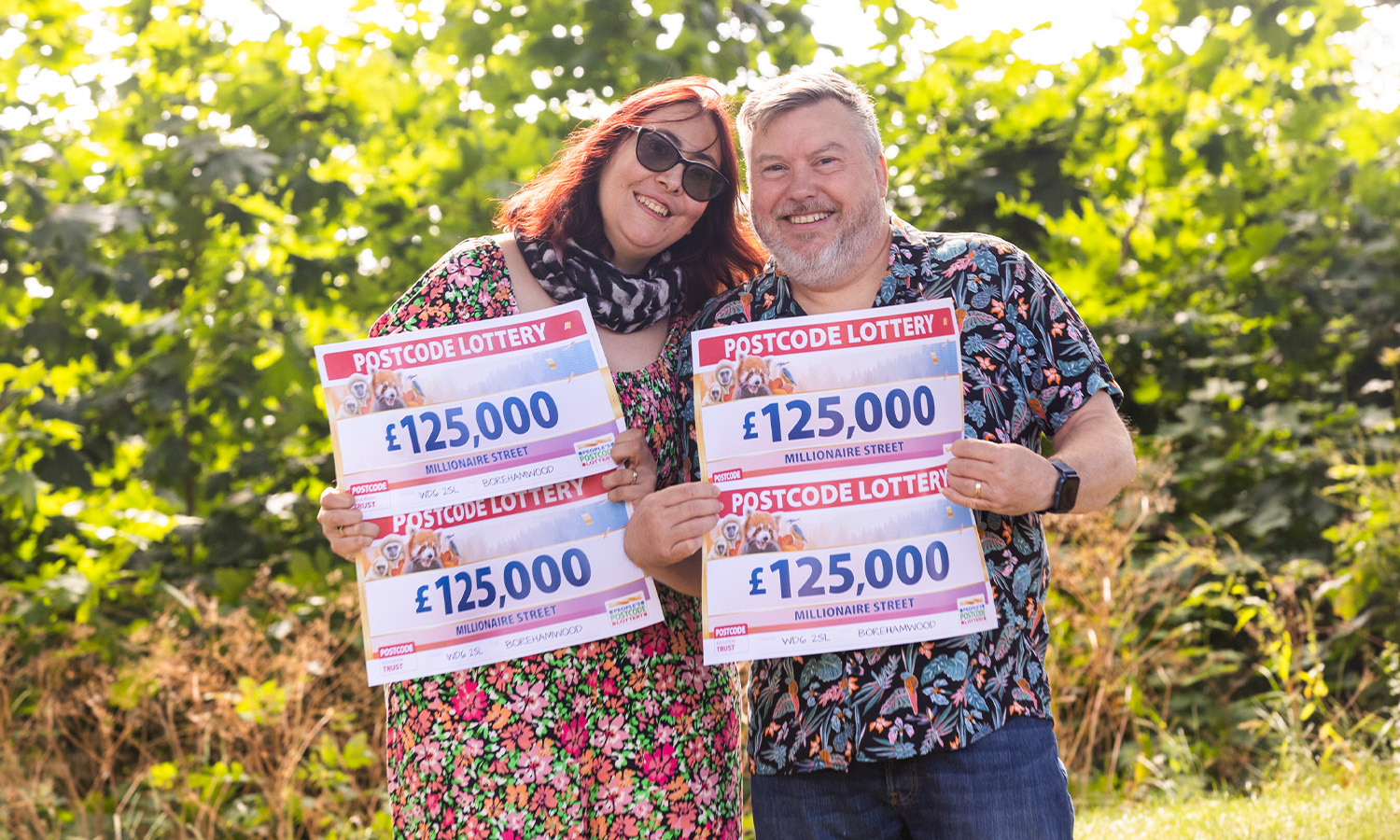 LIFE CHANGING: £500,000 winner Mark and wife Billie pose with his winning cheques